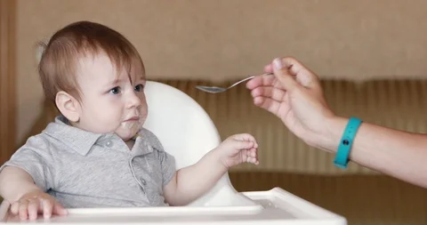 Baby eating mashed potatoes Stock-Footage 112386325
