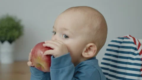 Baby eats an apple Stock Footage 143361207