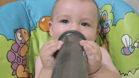 Baby eats from a bottle Stock Footage 124875677