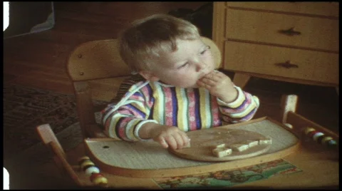 Baby eats bread (vintage 8 mm amateur film) Stock Footage 508797