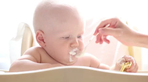 Baby eats a highchair closeup Stock Footage 40757543