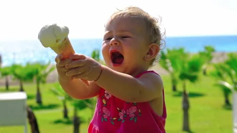 Baby eats ice cream in the summer. Selective focus. Stock Footage 169013906