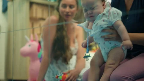 Baby engaging in early intervention physical therapy exercises with a therapist, 스톡 동영상 343294419