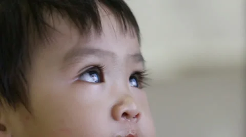 Baby face when looking television Stock Footage 34707200