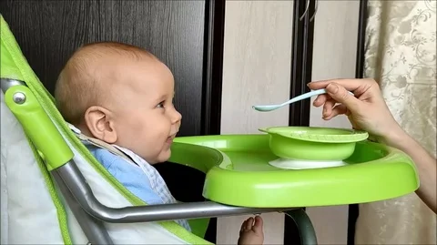 Baby feeding Stock Footage 129846136