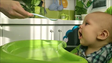 Baby feeding Stock Footage 129846552