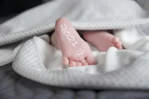 Baby feet for new year 2021. Stock Photos