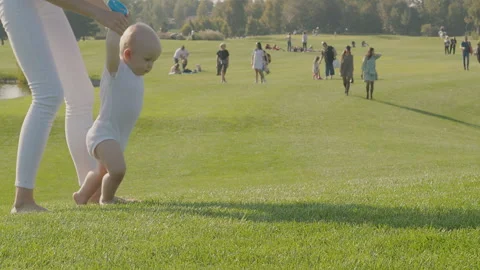 Baby first steps 2 Stock Footage 264573932