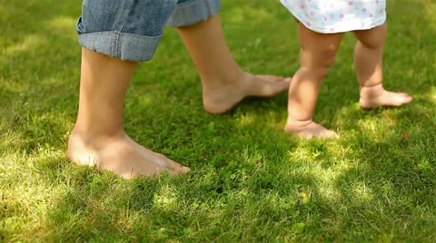 Baby first steps on grass Stock Footage 25031948
