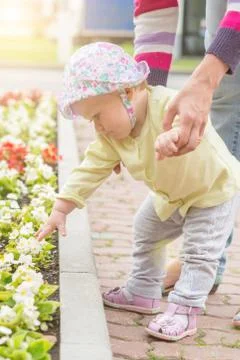 Baby first steps with mom Stock Photos