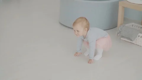 Baby First Steps, Slow Motion. Close up on feet. Baby milestone, toddler, 1 year Stock Footage 89813413