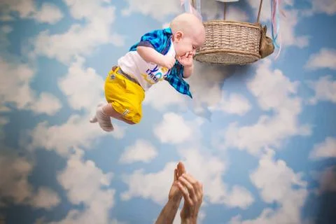 Baby flies in the clouds Stock Photos