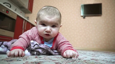 Baby on the floor Stock Footage 76953181