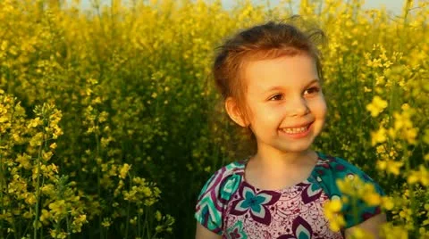 Baby in the flowers. Laugh. Stock Footage 11129505