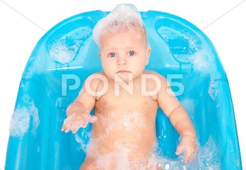 Baby in foam Stock Photos