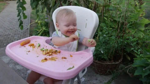 Baby Girl Feed Dog Broccoli - 4k Stock Footage