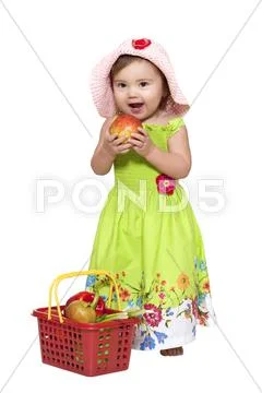 Baby girl with fruits Stock Photos