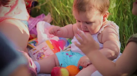 Baby girl touch the apple Stock Footage 42419085