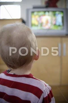 Baby Girl Watching TV Stock Photos