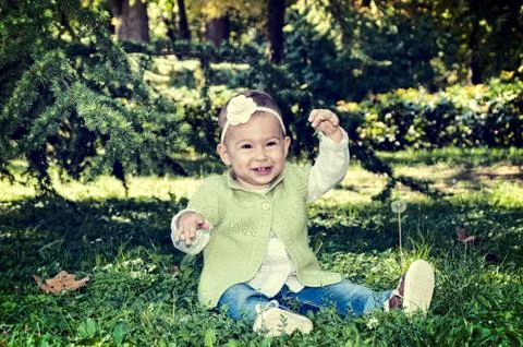 Baby in grass Stock Photos