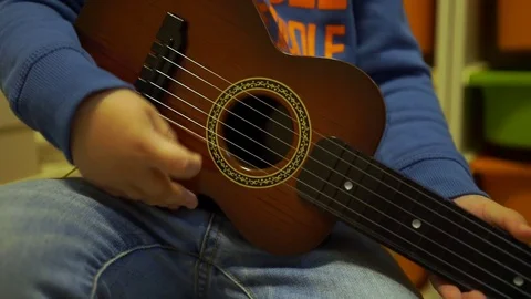 Baby with guitar close up Stock Footage 71702345