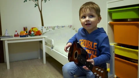 Baby with guitar Stock Footage 71701899