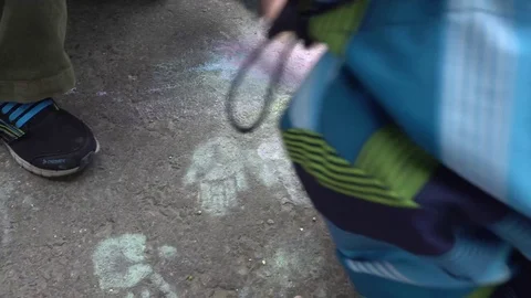 Baby hand drawing with colored chalks on the pavement Stock Footage 76215158