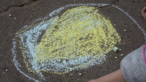 Baby hand drawing with colored chalks on the pavement Stock Footage 76215588