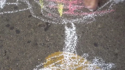 Baby hand drawing with colored chalks on the pavement Stock Footage 76215673