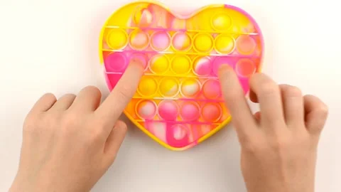 Baby hands play with pop it silicone toy. Stock Footage 157724080
