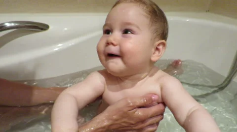 Baby having a bath with mum Stock Footage 44120029