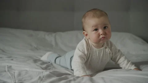 Baby infant kid falling down in an attempt to crawl 動画素材 205030097