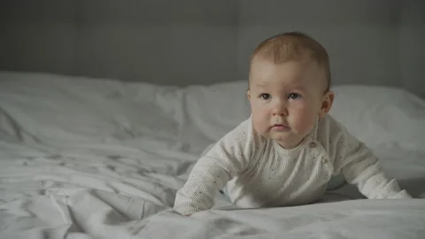 Baby infant kid falling down in an attempt to crawl 動画素材 205063336
