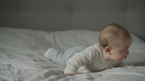 Baby infant kid falling down in an attempt to crawl 動画素材 206826497