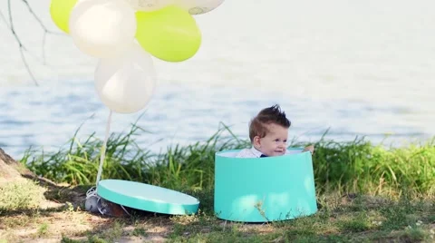 Baby inside the box with balloons Stock Footage 68652047