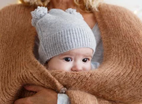 Baby inside the jacket Stock Photos