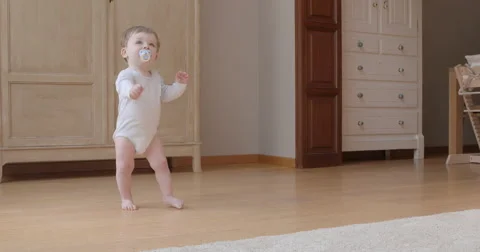 Baby keeping balance while standing Stock Footage 50146727