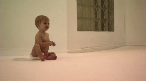 Baby learning to crawl Stock Footage 43696214