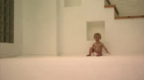 Baby learning to crawl Stock Footage 43696315
