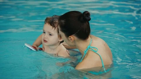 The baby learning to dive Stock Footage 75236881