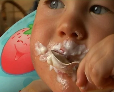 Baby learning to feed himself  Stock Footage 513794