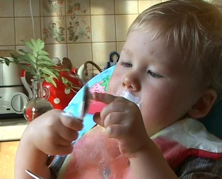  Baby learning to feed himself Stock Footage 513917