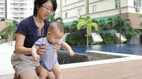 Baby learning how to stand Stock Footage 46205285