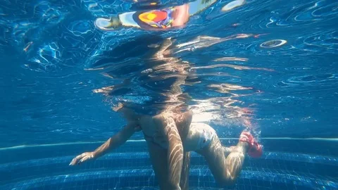 Baby learning to swim Stock Footage
