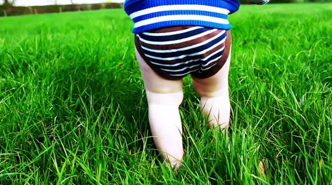 Baby learning to walk Stock Footage 64288055