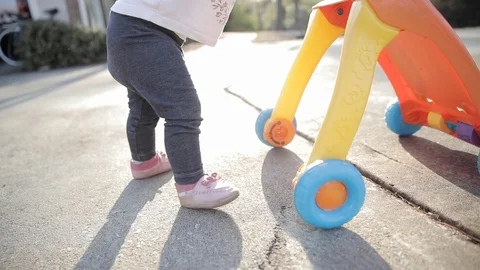 Baby Learning to Walk in Slow Motion Stock Footage 122830868