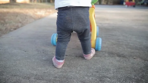 Baby Learning to Walk in Slow Motion Stock Footage 122831033