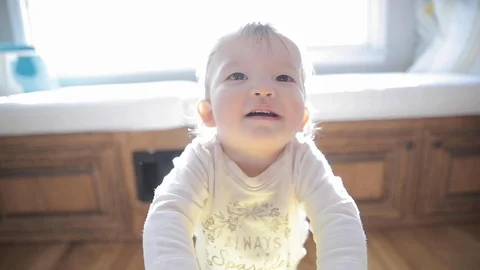 Baby Learning to Walk in Slow Motion Stock Footage 122835518