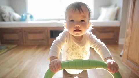 Baby Learning to Walk in Slow Motion Stock Footage 122839845