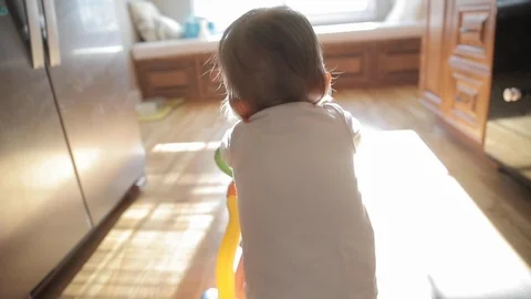Baby Learning to Walk in Slow Motion Stock Footage 122840464